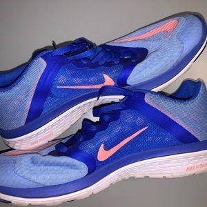 Blue and peach Nike shoes